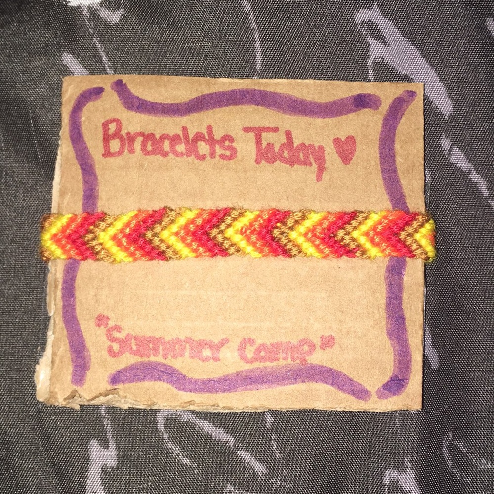 A chevron styled bracelet, made of cotton string.